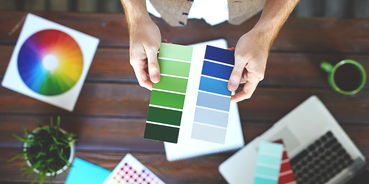 Image of deciding on color, picking the right color for your logo with the help of a palette and flyer.
